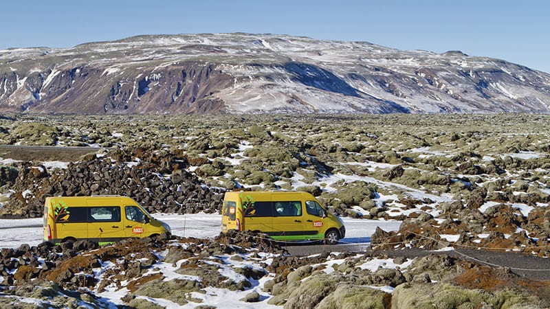 Twi campervans driving in a lava field