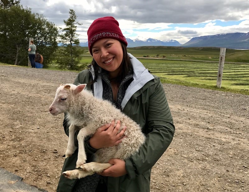 Woman holding a lamb