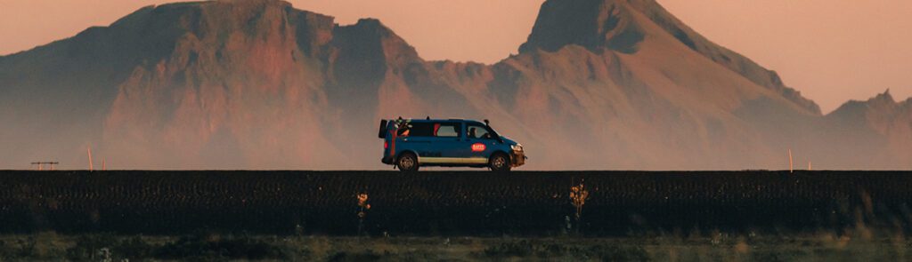 A Happy Campers campervan driving through the Icelandic Highlands