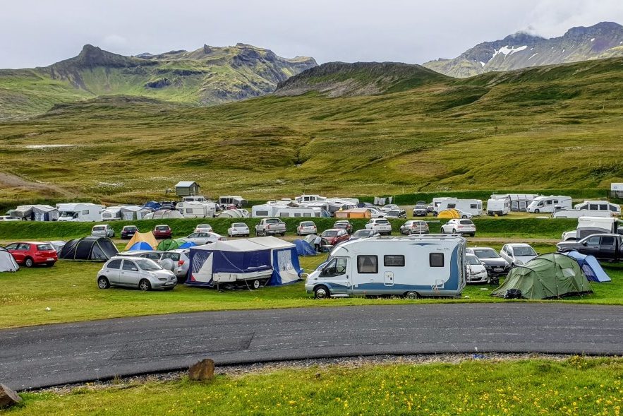 cheap campsite in grundarfjordur in iceland full of motor homes and campervans
